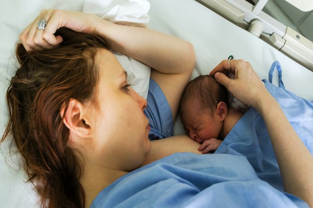 baby being cradled by mother to represent maternity safety alliance