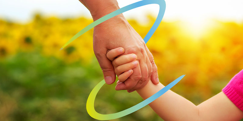 adult and child holding hands